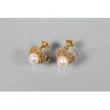 A pair of cultured pearl set earrings in open beadwork mounts, screw fittings, stamped 9ct