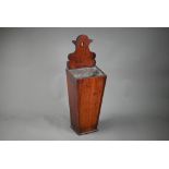 A 19th century mahogany candle-box of tapering form, converted as a wall-vase with tin liner