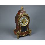 An antique French gilt metal mounted boulle mantel clock, the 8-day Rollin movement with gilt dial