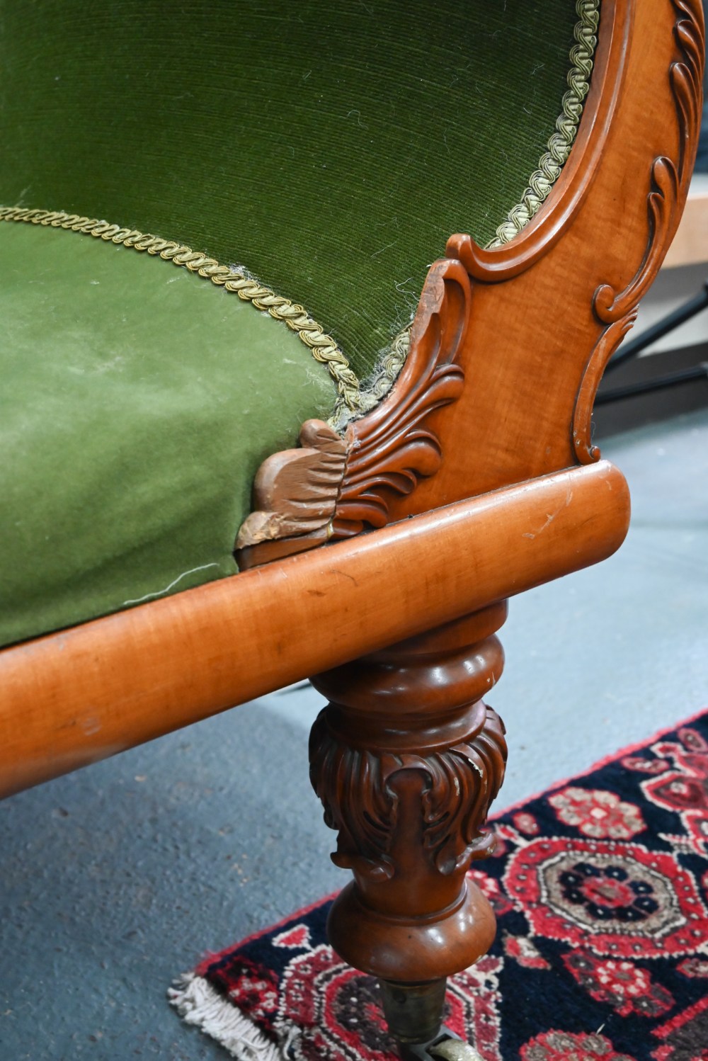 A late Victorian walnut framed single scroll end chaise, upholstered in green dralon, raised on - Image 4 of 8