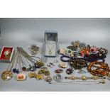 A collection of vintage costume jewelllery including bead necklaces, pendants, brooches, etc