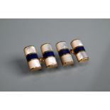 A pair of rectangular 9ct yellow gold rectangular cufflinks set white quartz with lapis lazuli band