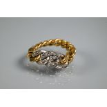 A yellow and white metal unmarked ring in the form of graduated cable links, set diamonds, size M,