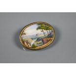 An oval painted porcelain plaque featuring classical Italianate landscape, with brooch fitting, 3.