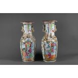 A pair of 19th century Chinese canton famille rose vases, baluster form with everted foliate rims