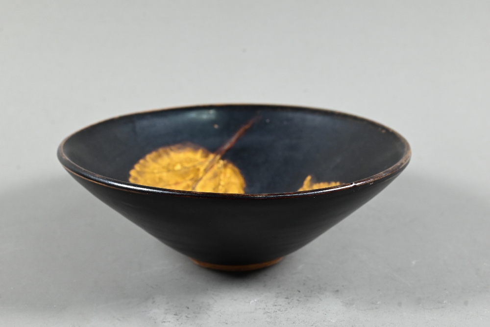 A Chinese Southern Song style Jizhou stoneware conical bowl, the interior with two leaf resists