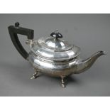 A heavy quality silver bachelor teapot of ovoid form, with composite handle and finial, on hoof