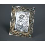 A 19th Century Continental silver gilt pocket icon, engraved with the Madonna after Fra Lippi, in