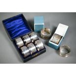 WITHDRAWN A set of six plain silver napkin rings,