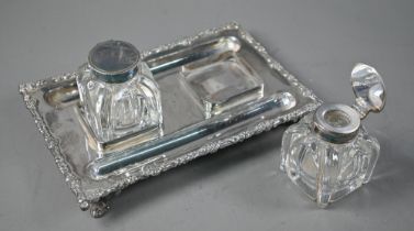 A Victorian EPBM inkstand with twin glass bottles, with cast rim and four scroll feet, James Dixon &