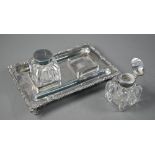 A Victorian EPBM inkstand with twin glass bottles, with cast rim and four scroll feet, James Dixon &