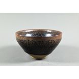 A Chinese Jianyao 'Hares fur' bowl, Southern Song dynasty style, covered with a thick unctuous black