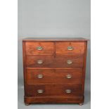 An Edwardian shallow stained chest of two short over three long graduated drawers, on bun feet,