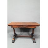 A William IV rosewood library table, with single long frieze drawer, raised on twin scroll end