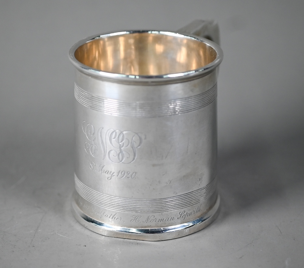 Silver Christening mug in the Georgian manner, of tapering form with reeded bands and scroll handle,