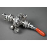 A Victorian silver baby's rattle with whistle, coral teether and four bells, George Unite,