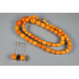 A graduated butterscotch amber necklace, the oval beads from 2.5 x 1.8cm to 1.0 x 0.8 cm, approx