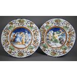 A pair of 19th century Italian majolica chargers in the Istoriato tradition, depicting Jupiter and