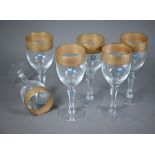 A set of six Murano wine glasses with decorative gilt rims, 19 cm high