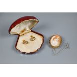 An oval shell cameo brooch featuring Rachel at the well, in belcher-chain style mount stamped 9ct,