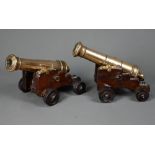 A pair of 19th century table cannons modelled on Garrison cannon, the 20 cm long bronze barrels on