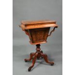 Victorian inlaid mahogany work table, the interior paper lined, raised on hip carved quad legs to