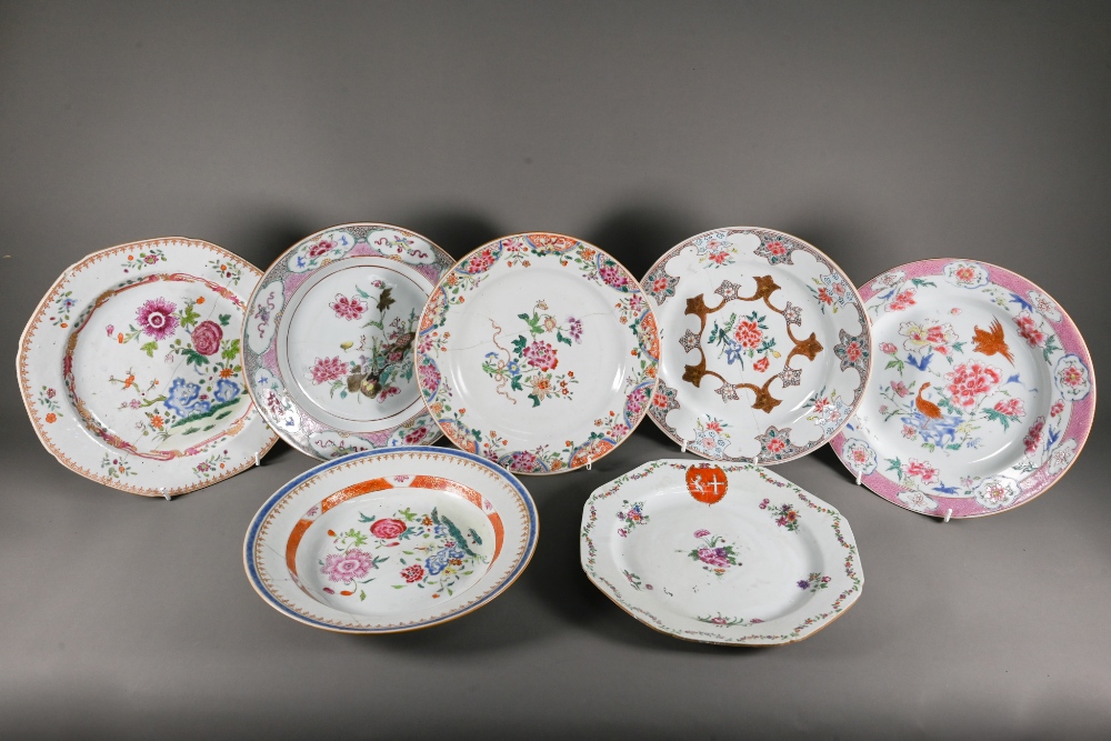 Six 18th century Chinese famille rose plates (four circular and two octagonal) painted with a