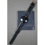 WITHDRAWN A Rado Dia Star wristwatch, black dial and gilt, with black leather strap,