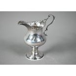 Hester Bateman: a silver baluster cream jug with impressed beaded rim, scroll handle and stemmed