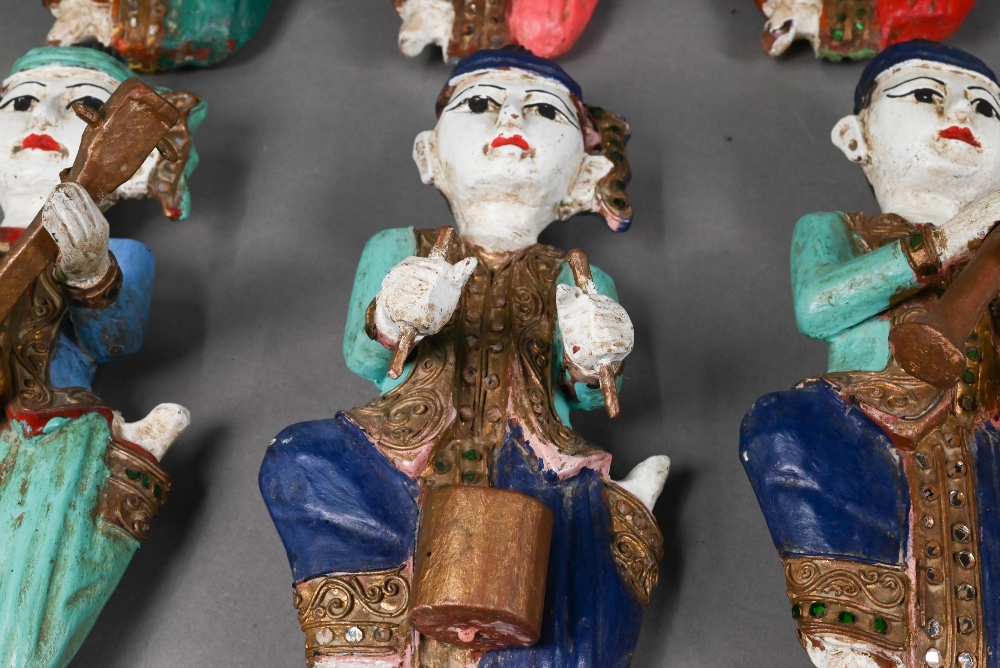 A set of seven vintage polychrome Burmese temple musician wall plaques, carved hardwood with - Image 6 of 9