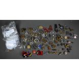 A quantity of assorted world military cap badges, insignia and tunic buttons incl. Belgium, Dutch,