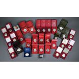 A complete set of twenty-three boxed Halcyon Days enamel Christmas boxes 1980-2002 to/w three
