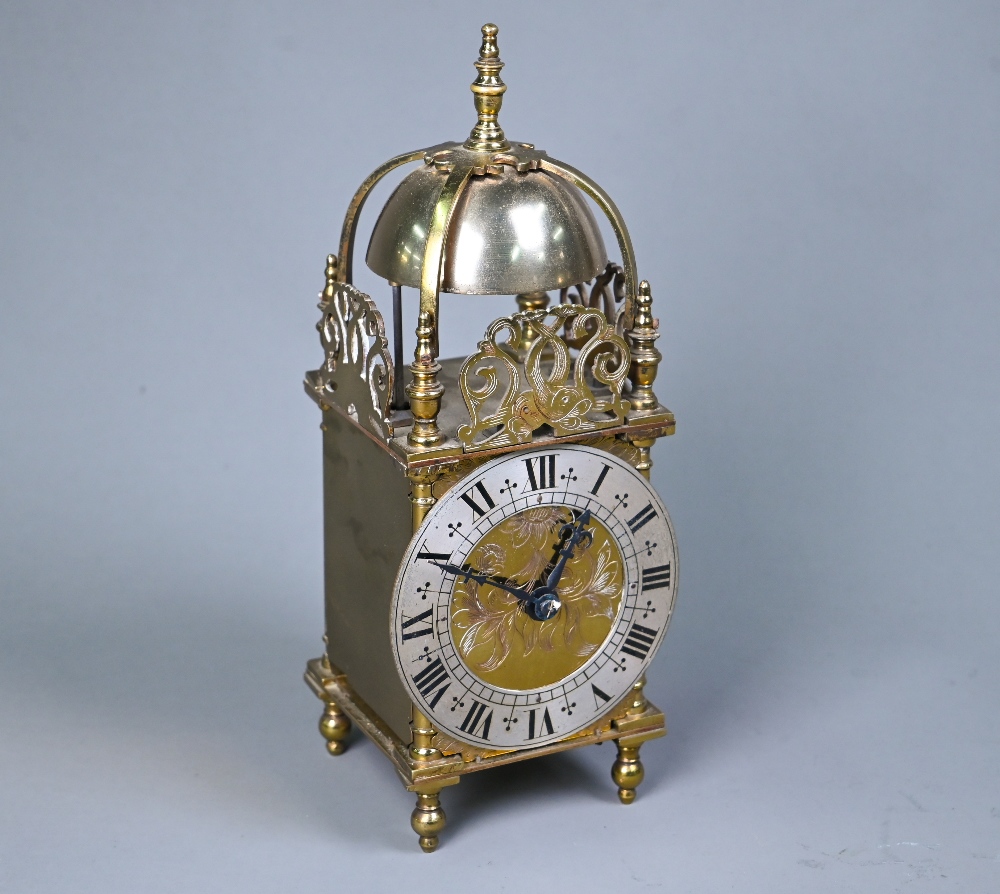 A contemporary miniature brass lantern clock, the 8-day movement striking the hours and half hours