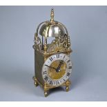 A contemporary miniature brass lantern clock, the 8-day movement striking the hours and half hours