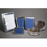 A pair of silver plated bottle coasters with turned wood bases, to/w four electroplated photograph