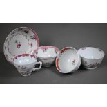 A New Hall tea bowl and saucer with floral and pink scale decoration, to/w a similar coffee cup