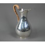 Hester Bateman: a George III silver pear-shaped water-jug with beaded rim and wicker-bound handle,