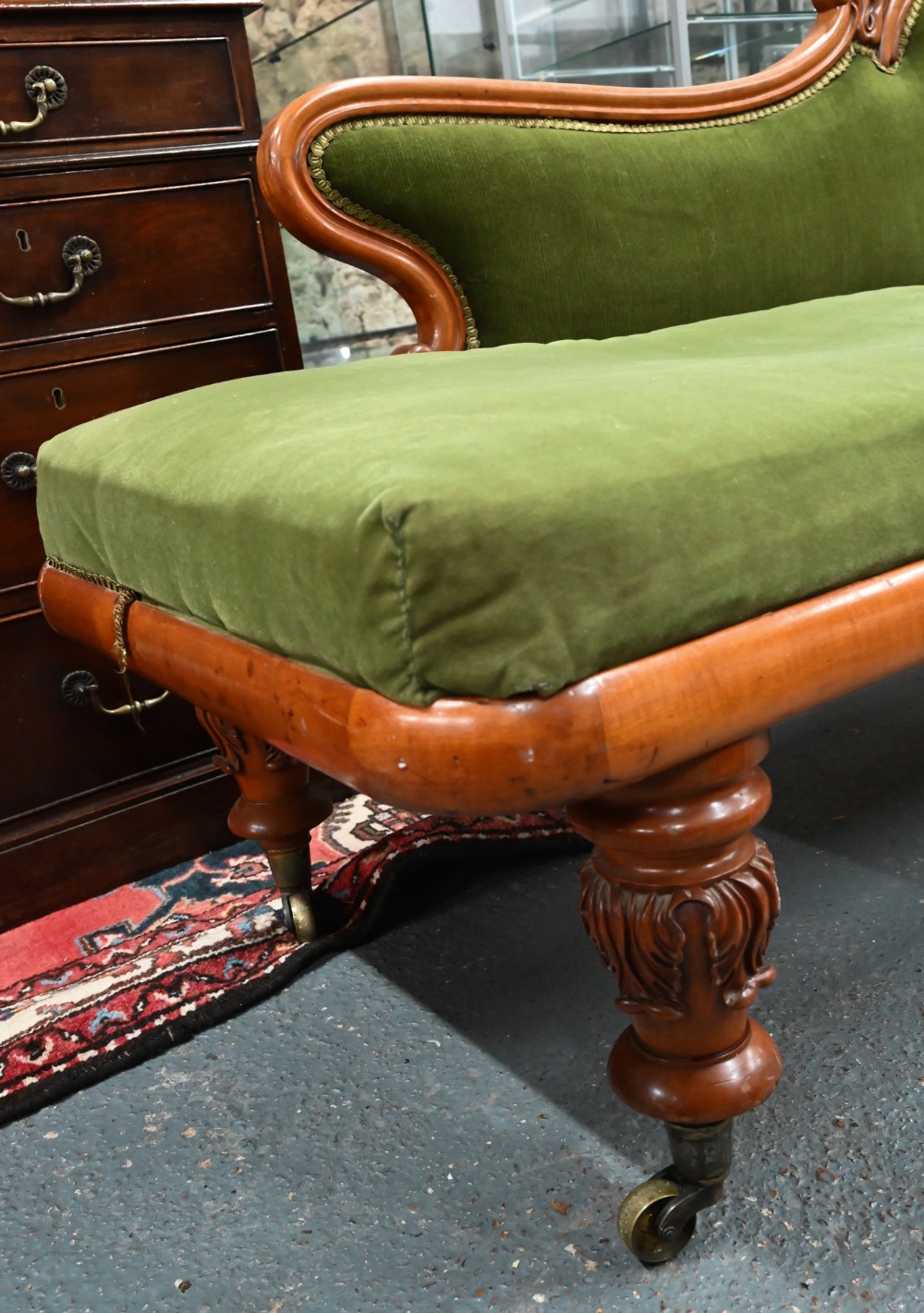 A late Victorian walnut framed single scroll end chaise, upholstered in green dralon, raised on - Image 2 of 8