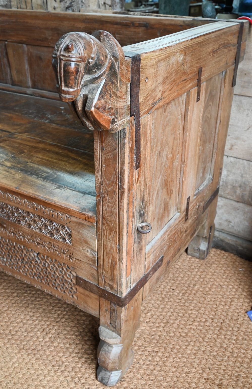 A substantial Rajasthan teak 'horse head' box bench, with hinged storage compartment, 162 cm w x - Image 6 of 10