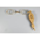A Victorian 15ct yellow gold lorgnette with Gothic-style decoration, and engraved with initials,