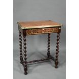 A Victorian brass mounted leather top Boulle panelled writing table, with frieze drawer, raised on