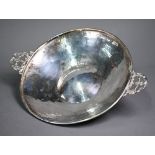 A planished silver fruit-bowl with twin scrolling handles, Albert Ernest Jenkins, Birmingham 1920,