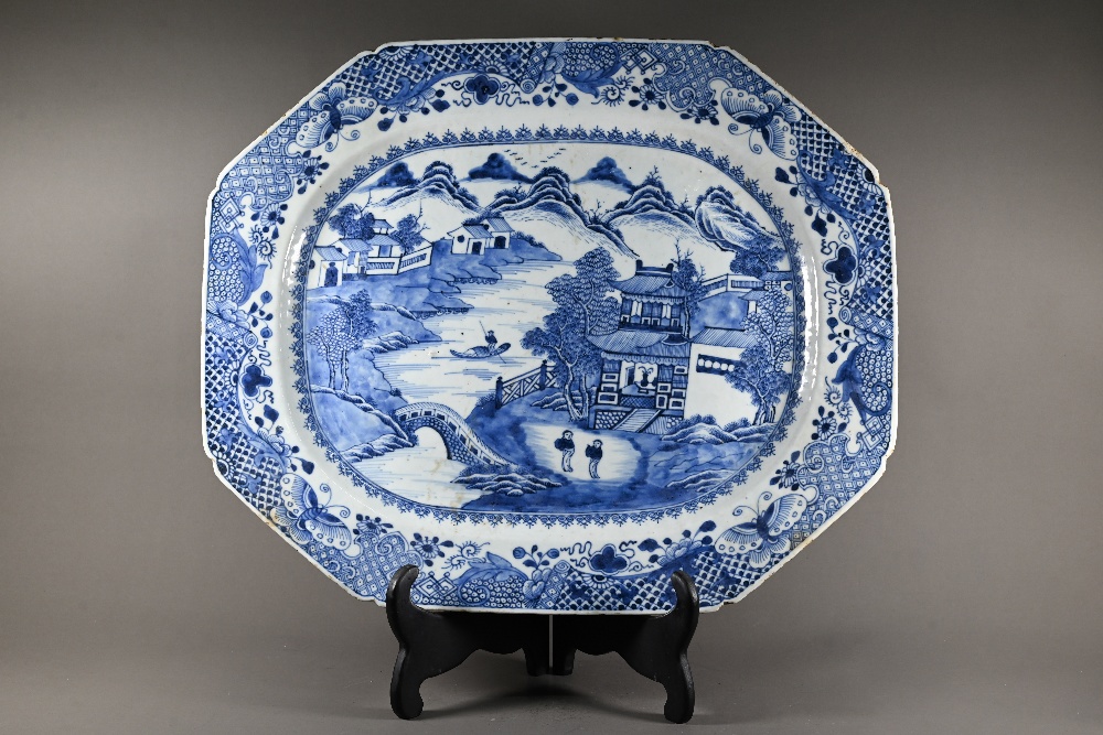 An 18th century Chinese blue and white platter of lobed octagonal form, painted with figures in