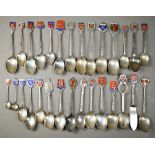 Twenty four silver and enamel Jersey and Guernsey souvenir spoons, 7.8oz gross weight, to/w four