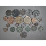 A collection of twenty three Roman and other ancient coins - not identified