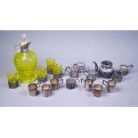 An Edwardian silver-mounted cut uranium glass liqueur decanter and four matching glasses in