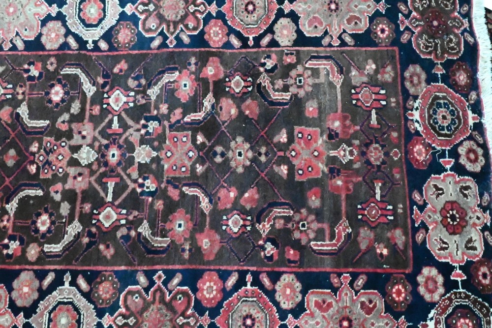 A Persian blue ground Lilihan runner, the repeating geometric design on brown ground, 296 cm x 104 - Image 2 of 3