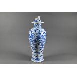 A 19th century Chinese blue and white 'dragon' vase and domed cover with moulded guardian lion