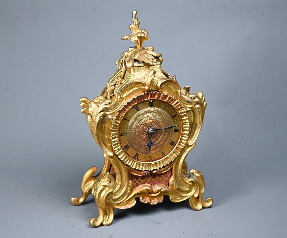 A French gilt ormolu cased 8-day fusee mantel clock, in the rococo style, with engine turned dial,