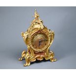 A French gilt ormolu cased 8-day fusee mantel clock, in the rococo style, with engine turned dial,